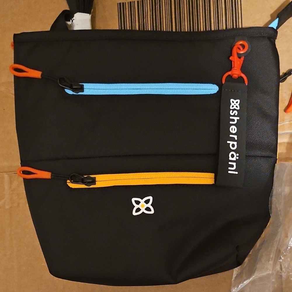 Sherpani Black Backpack with Blue and Orange Zippers